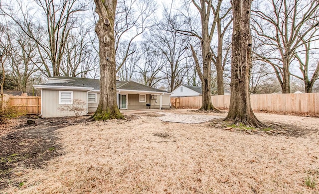 back of house with a patio