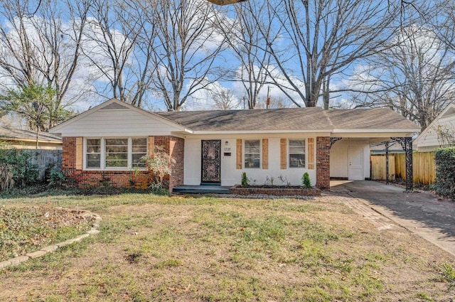 single story home featuring a carport and a front lawn