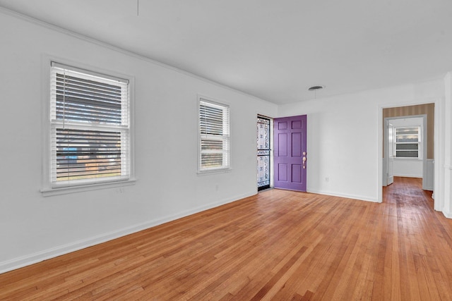 unfurnished room featuring light wood-type flooring