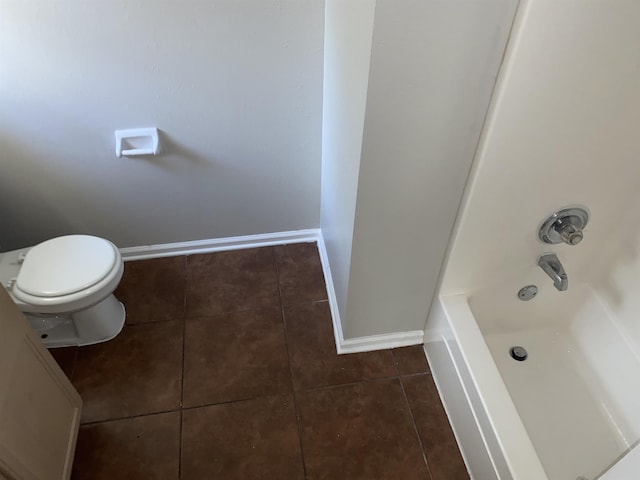 bathroom with tile patterned flooring and toilet