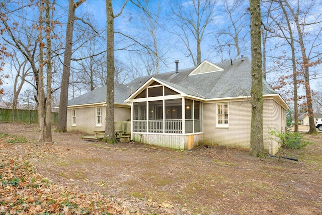 back of property featuring a sunroom