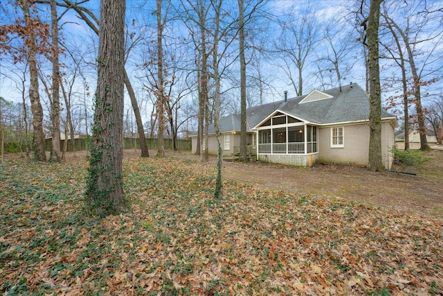 view of yard with a sunroom