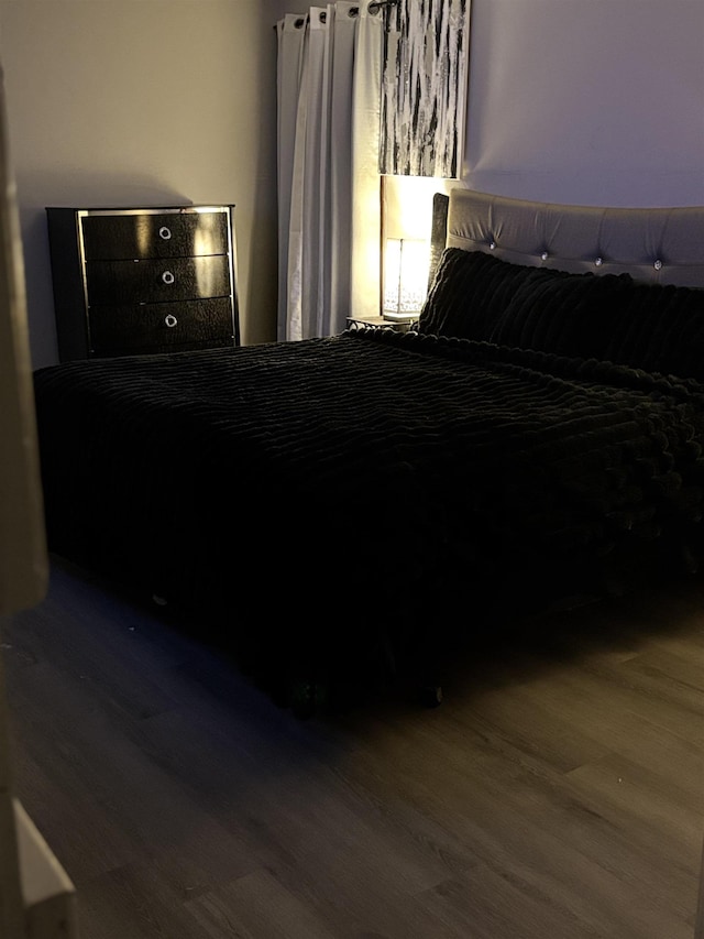 bedroom featuring hardwood / wood-style floors