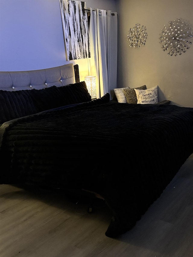 bedroom featuring wood-type flooring