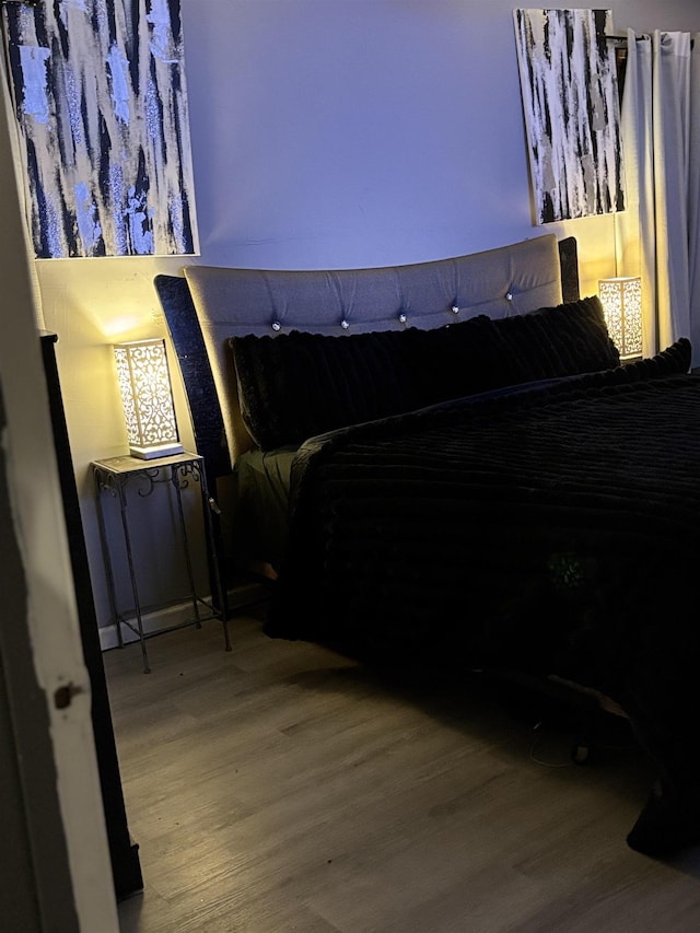 bedroom featuring wood-type flooring