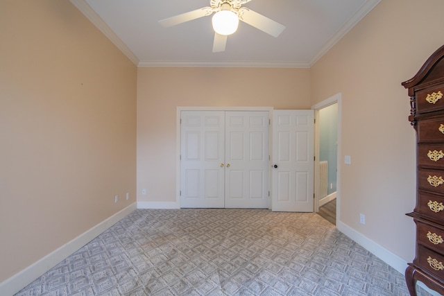 unfurnished bedroom featuring a closet, ceiling fan, and crown molding