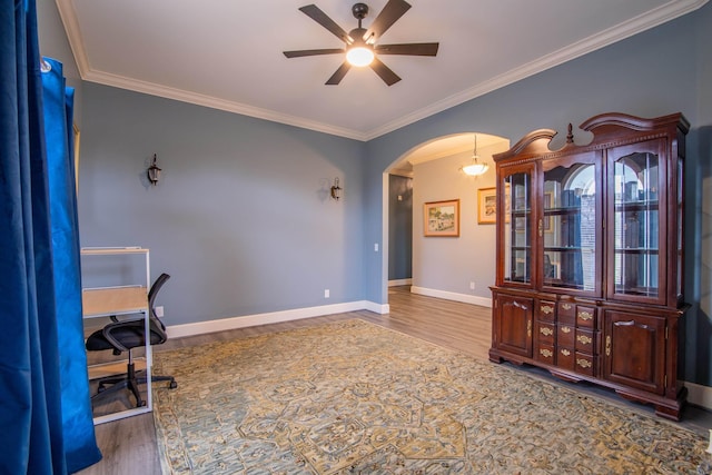 home office featuring crown molding, ceiling fan, and hardwood / wood-style flooring