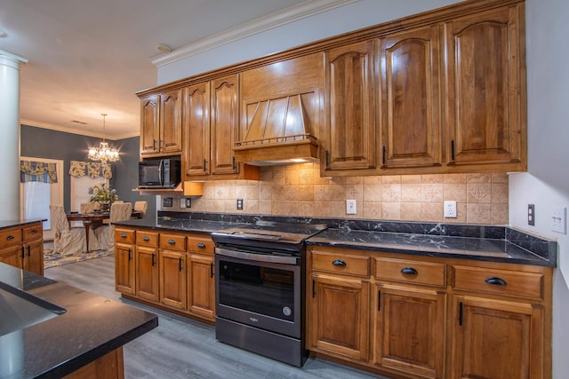 kitchen featuring an inviting chandelier, electric stove, light hardwood / wood-style flooring, decorative light fixtures, and custom range hood