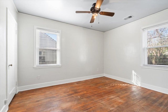 spare room with ceiling fan and wood-type flooring