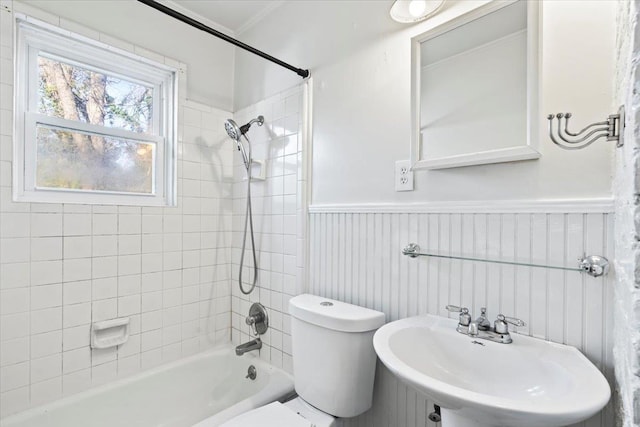 full bathroom with toilet, tiled shower / bath, and sink