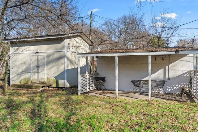 view of side of home featuring a yard