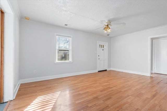 unfurnished room with a textured ceiling, light hardwood / wood-style floors, ceiling fan, and ornamental molding