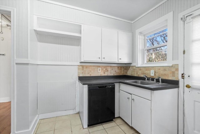 kitchen featuring black dishwasher, backsplash, white cabinetry, and sink