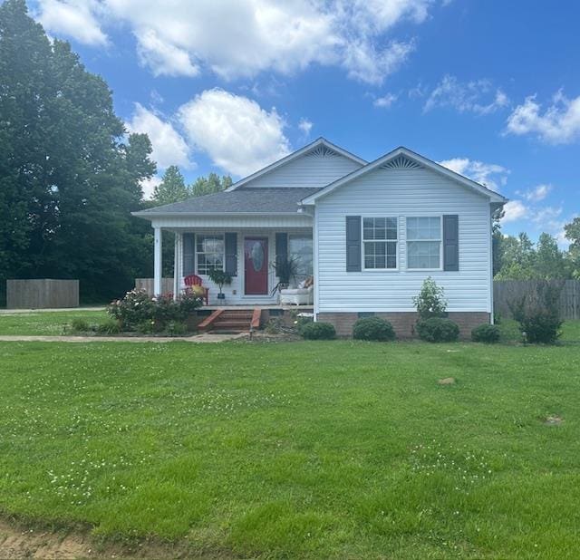 view of front of home featuring covered porch and a front yard