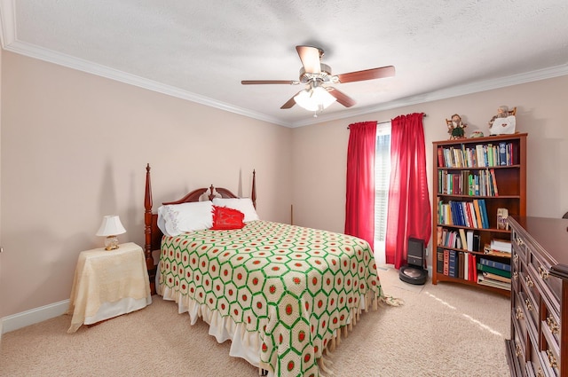 carpeted bedroom featuring ceiling fan, crown molding, and a textured ceiling