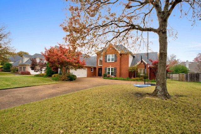 view of front property with a front lawn and a garage