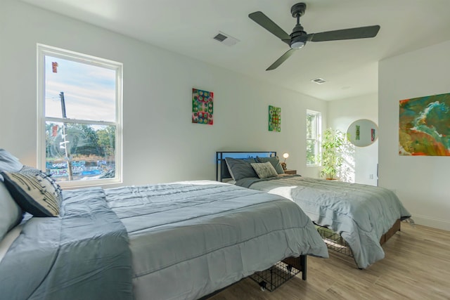 bedroom featuring ceiling fan and light wood-type flooring