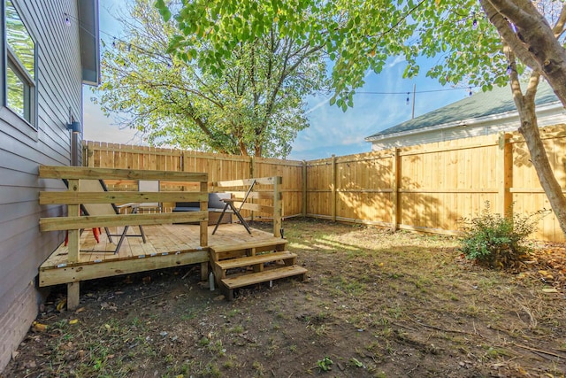 view of yard featuring a wooden deck