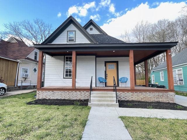 view of front of house featuring a front lawn and covered porch