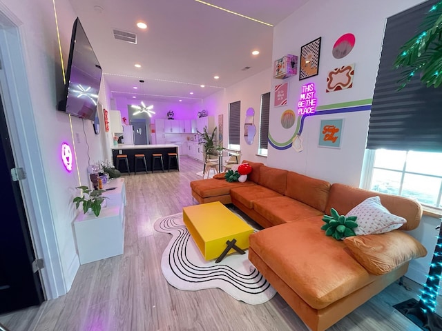 living room with light hardwood / wood-style floors