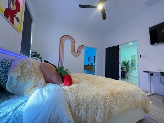 bedroom with ceiling fan and light hardwood / wood-style flooring