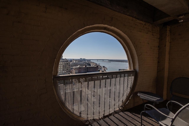 balcony featuring a water view