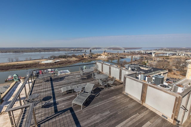 wooden terrace featuring a water view