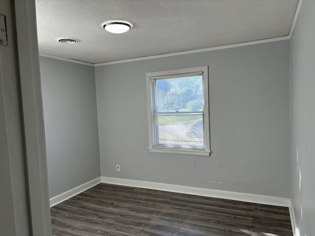 empty room with a textured ceiling, dark wood-type flooring, and crown molding