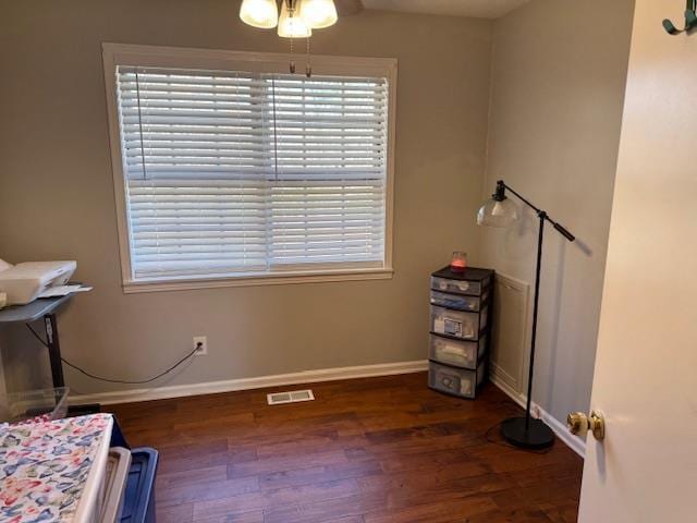 miscellaneous room with dark hardwood / wood-style floors