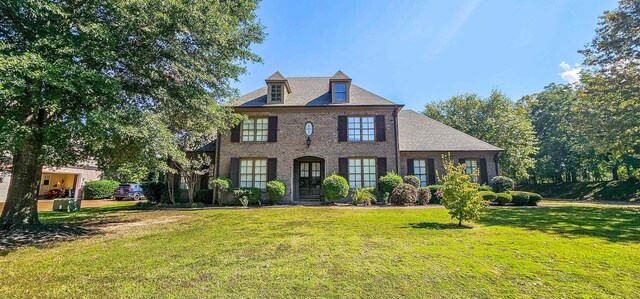 colonial home with a front yard