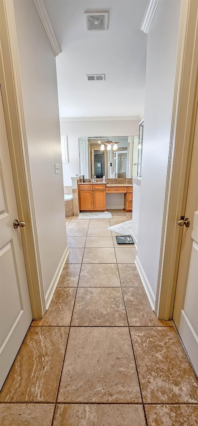 corridor featuring crown molding