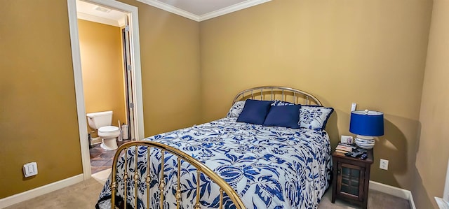 bedroom featuring ensuite bath, crown molding, and light carpet