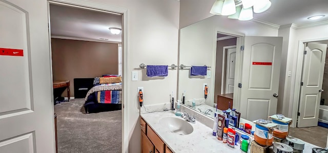 bathroom featuring crown molding and vanity