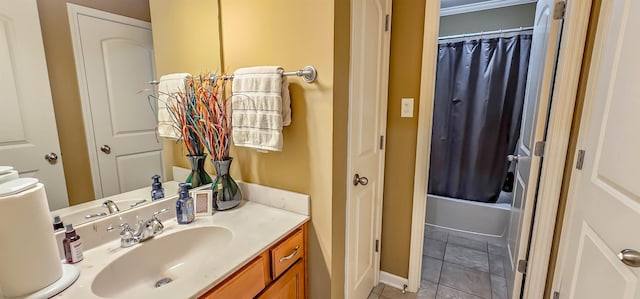 bathroom with tile patterned floors, shower / bathtub combination with curtain, vanity, and ornamental molding