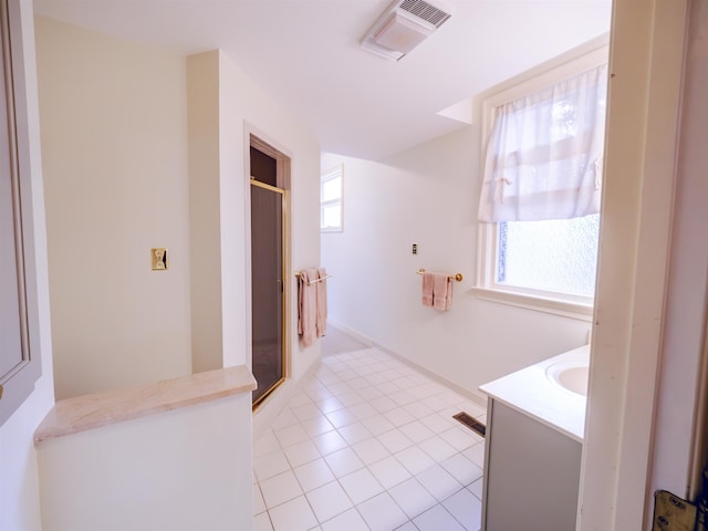 bathroom featuring tile patterned floors and vanity