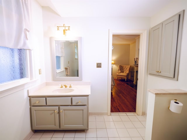 bathroom featuring tile patterned flooring and vanity