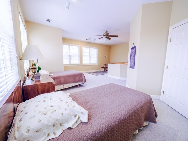 carpeted bedroom with ceiling fan