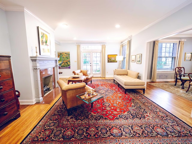 living room with hardwood / wood-style floors, french doors, and ornamental molding