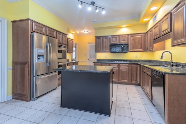 kitchen featuring sink, light tile patterned floors, black appliances, and a kitchen island