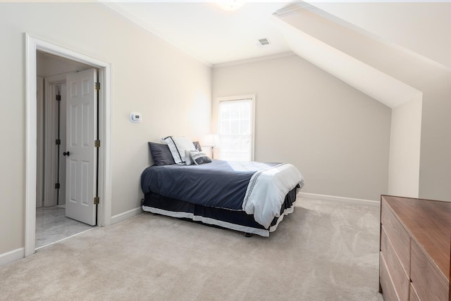 carpeted bedroom with lofted ceiling and crown molding