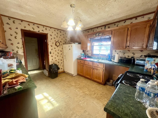 kitchen featuring an inviting chandelier, sink, hanging light fixtures, range with electric stovetop, and white fridge with ice dispenser