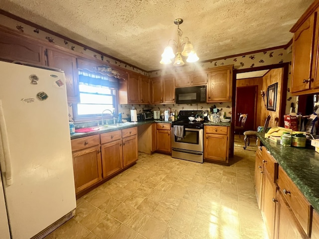 kitchen with stainless steel electric range oven, sink, hanging light fixtures, white fridge, and a chandelier