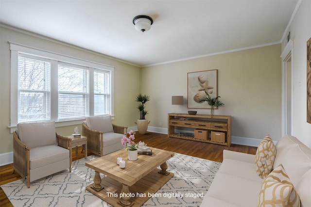 living room featuring crown molding and light hardwood / wood-style flooring