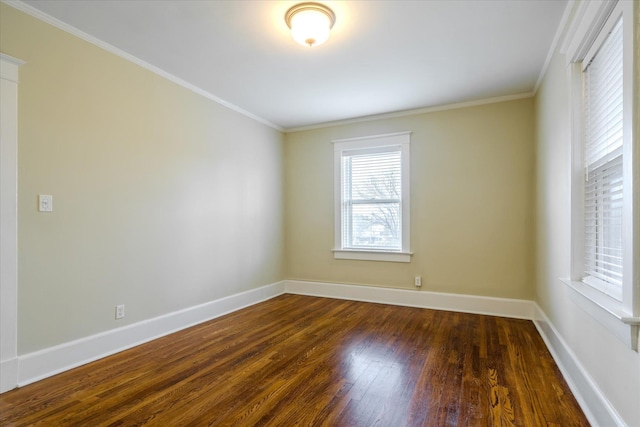 unfurnished room with dark hardwood / wood-style flooring and crown molding