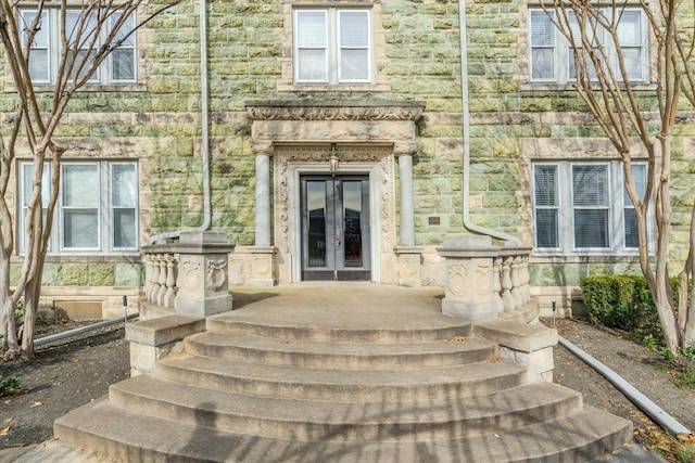 property entrance featuring french doors