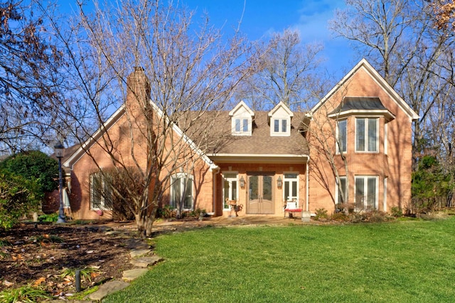 view of front facade featuring french doors and a front lawn