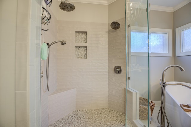 bathroom with a tile shower and crown molding