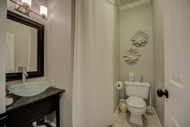 bathroom featuring tile patterned floors, vanity, toilet, and ornamental molding