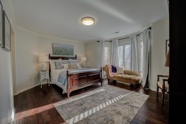 bedroom featuring dark hardwood / wood-style flooring and crown molding