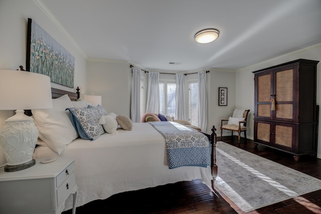 bedroom featuring dark hardwood / wood-style flooring and ornamental molding